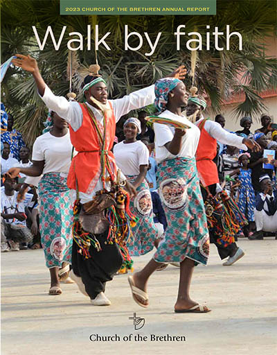 Cover of 2023 Annual Report showing celebration in Nigeria