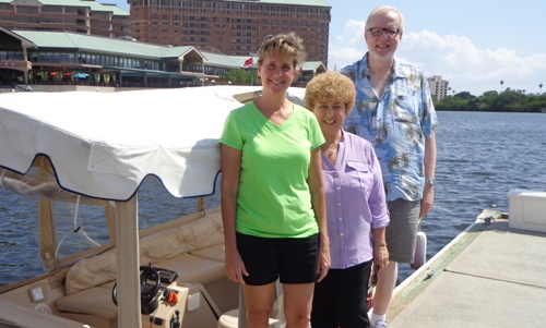 Annual Conference staff Debbie Noffsinger, Chris Douglas, and Jon Kobel standing by an E-boat in Tampa. Photo by Jane Godfrey
