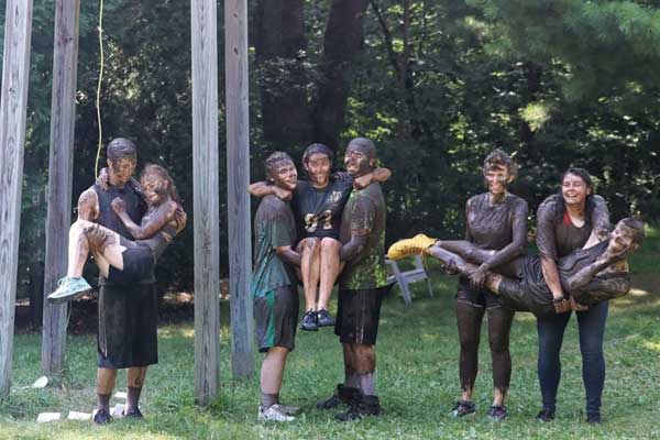 muddy people at Camp Emmaus