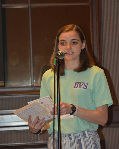 Person speaking at a mic