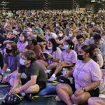 Youth sitting on the floor at National Youth Conference