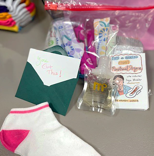 Socks, hygiene items, and a card that says "You got this!"