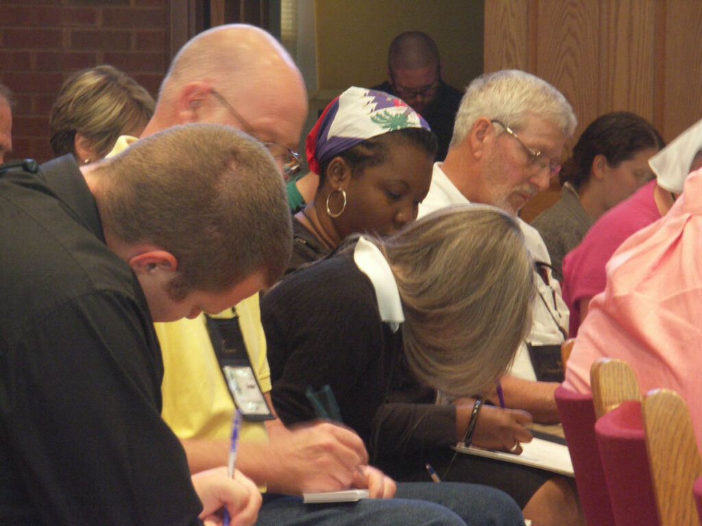 People taking notes at the New and Renew conference