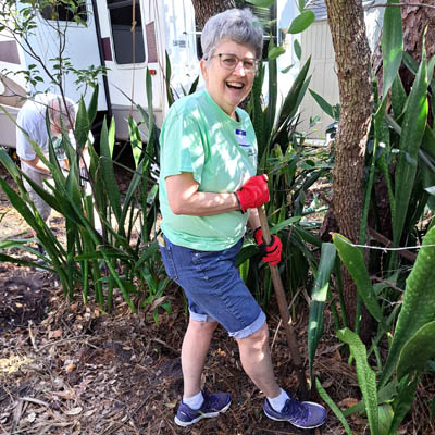 Smiling person gardening