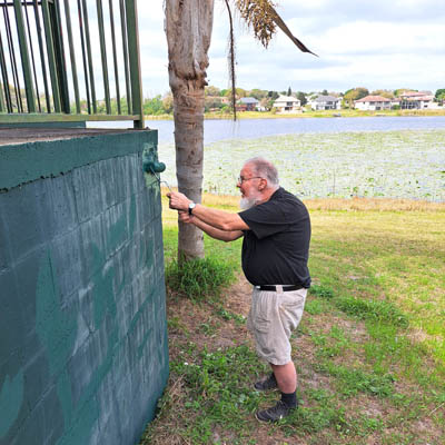 Person repairing a wall