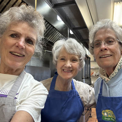 Three women smiling