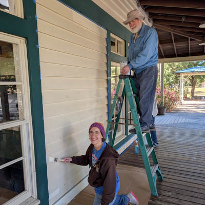 People painting a building