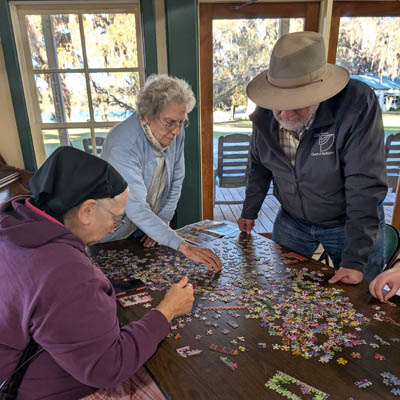 People doing a puzzle