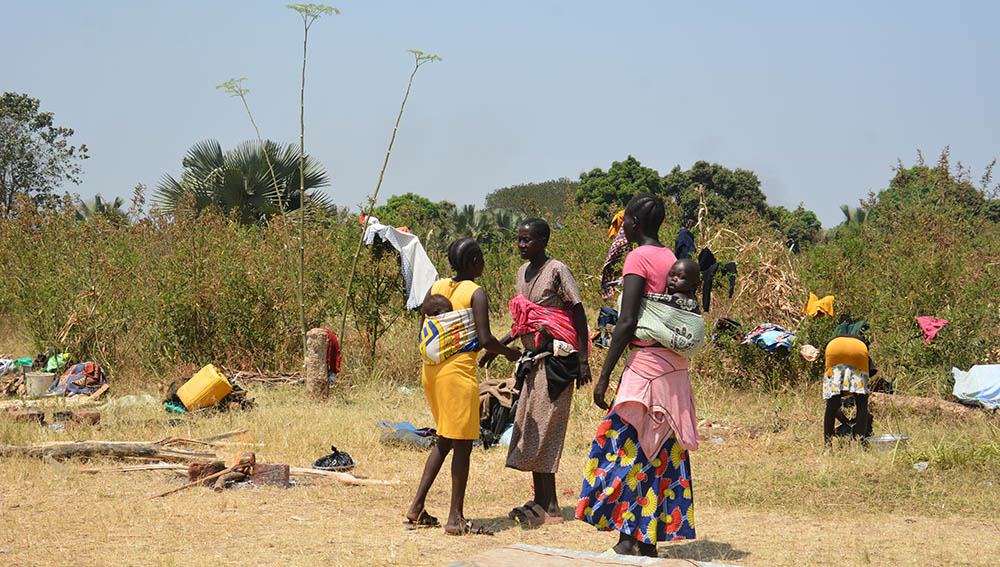 People standing outside chatting
