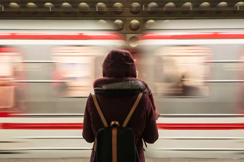 Person standing next to a moving train