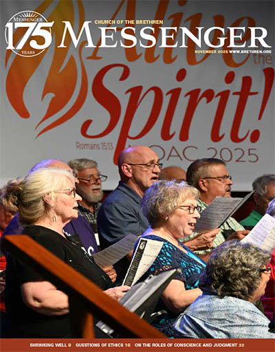 Choir singing at National Older Adult Conference, in front of a banner saying, "Alive in the Spirit!"