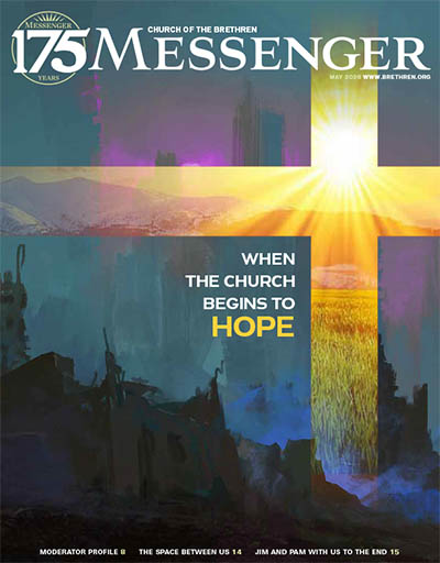 Cover of May 2026 Messenger with cross made of light