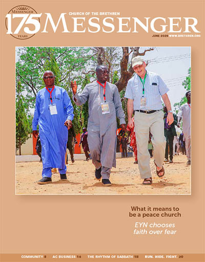 Cover of June 2026 Messenger, showing three men walking in Nigeria