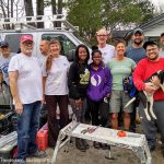 Disaster relief volunteers work on house damaged by hurricane Matthew