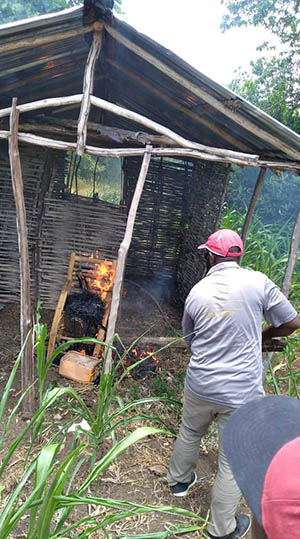 Man burning items in Haiti