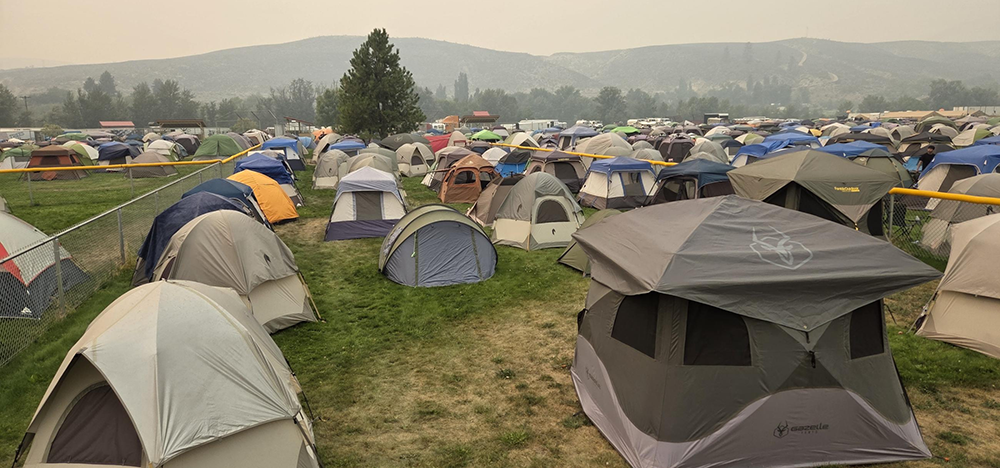 Tents in front of hills with smoky air