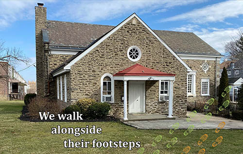 Stone church with the words 'We walk alongside their footsteps